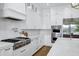 Chef's kitchen boasting stainless steel appliances, ample counter space, and modern white cabinetry at 3010 E Fruitvale Ave, Gilbert, AZ 85297