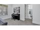 Bright room with piano. View through doorway to bathroom with shower at 3010 E Fruitvale Ave, Gilbert, AZ 85297
