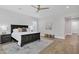 Main bedroom featuring hardwood floors, dark wood furniture, and neutral decor at 3010 E Fruitvale Ave, Gilbert, AZ 85297