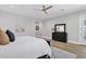 Well-lit main bedroom featuring hardwood floors and dark wood furniture at 3010 E Fruitvale Ave, Gilbert, AZ 85297