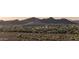 Scenic aerial view of a community nestled against a backdrop of stunning mountain views at 30404 N 131St Dr, Peoria, AZ 85383