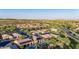 Expansive aerial view of a neighborhood with well-maintained homes, pools, and lush landscaping at 30404 N 131St Dr, Peoria, AZ 85383