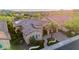 Stunning aerial view of a home with lush landscaping, a driveway, and a beautiful desert setting at 30404 N 131St Dr, Peoria, AZ 85383