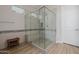 Large walk-in shower with bench, stone floors, and neutral tiling at 30404 N 131St Dr, Peoria, AZ 85383