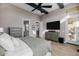 Serene bedroom with a neutral color palette, wood floors, and an ensuite bathroom and walk-in closet at 30404 N 131St Dr, Peoria, AZ 85383