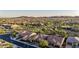 Picturesque aerial shot of a desert neighborhood with mountain views at sunset at 30404 N 131St Dr, Peoria, AZ 85383