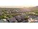 Wide aerial view of a desert community surrounded by natural desert landscape and mountains at 30404 N 131St Dr, Peoria, AZ 85383