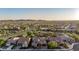Scenic aerial view showcasing a neighborhood nestled in the desert with mountains in the distance at 30404 N 131St Dr, Peoria, AZ 85383