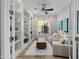 Bright office with built-in bookshelves, seating, and natural light at 30404 N 131St Dr, Peoria, AZ 85383