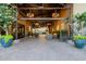 Welcoming outdoor patio with elegant lighting, comfortable seating, and a paved brick floor at 30404 N 131St Dr, Peoria, AZ 85383