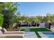 Inviting outdoor patio area with comfortable seating and lush landscaping, perfect for relaxation at 30404 N 131St Dr, Peoria, AZ 85383