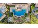 Aerial view of a backyard featuring a geometric pool, lounge chairs and palm trees at 30404 N 131St Dr, Peoria, AZ 85383