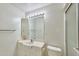 A full bathroom with a vanity sink, toilet, shower and a large mirror with lights at 325 W Loma Ln, Phoenix, AZ 85021