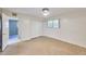 A bedroom with stained concrete flooring, white walls, closet with sliding doors and a doorway at 325 W Loma Ln, Phoenix, AZ 85021