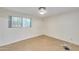 A bedroom with stained concrete flooring, white walls and trim, and one window at 325 W Loma Ln, Phoenix, AZ 85021