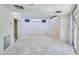 Generous bedroom features an AC unit and closet, with neutral walls ready for your personal touch at 325 W Loma Ln, Phoenix, AZ 85021