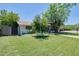 Well-manicured front lawn and charming single-story home at 325 W Loma Ln, Phoenix, AZ 85021