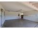 A clean open garage area with access door and window at 325 W Loma Ln, Phoenix, AZ 85021