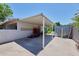Large garage with overhead covering and enough room for storage and parking at 325 W Loma Ln, Phoenix, AZ 85021