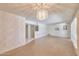 Open living area with unique wallpaper, chandelier and shuttered windows creating a welcoming space at 325 W Loma Ln, Phoenix, AZ 85021