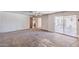 Spacious living room features a ceiling fan and sliding glass door to an outdoor patio at 325 W Loma Ln, Phoenix, AZ 85021