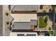 Aerial view of the house highlighting the roof and backyard with desert landscaping at 3338 E Lavey Ln, Phoenix, AZ 85032
