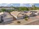 An aerial view of single-Gathering homes featuring desert landscaping and tile roofs in a vibrant community at 3338 E Lavey Ln, Phoenix, AZ 85032