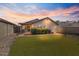 Spacious backyard with artificial grass, perfect for outdoor entertaining at 3338 E Lavey Ln, Phoenix, AZ 85032