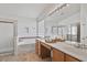 Bright bathroom with a double sink vanity, soaking tub, and glass-enclosed shower at 3338 E Lavey Ln, Phoenix, AZ 85032