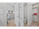 View from doorway to a bedroom featuring a walk-in closet and en suite bathroom at 3338 E Lavey Ln, Phoenix, AZ 85032