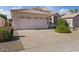Single-story home with a well-maintained front yard and a two-car garage at 3338 E Lavey Ln, Phoenix, AZ 85032