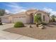 Well-maintained single-story home with desert landscaping and a two-car garage at 3338 E Lavey Ln, Phoenix, AZ 85032