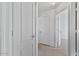 Hallway featuring modern doors, neutral carpet and bright lighting at 3338 E Lavey Ln, Phoenix, AZ 85032