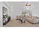 Bright living room with neutral decor, a ceiling fan, and a sliding glass door at 3338 E Lavey Ln, Phoenix, AZ 85032