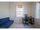 Bedroom with neutral paint, desk, and large windows at 34979 N 30Th Ave, Phoenix, AZ 85086