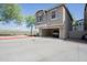 Two-story home featuring a two-car tandem garage, neutral color palette, and low-maintenance desert landscaping at 34979 N 30Th Ave, Phoenix, AZ 85086
