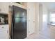 Kitchen with stainless steel refrigerator and adjacent doorway at 34979 N 30Th Ave, Phoenix, AZ 85086