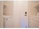 Laundry room featuring a washer and dryer with white walls, and storage shelving at 34979 N 30Th Ave, Phoenix, AZ 85086