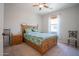Bedroom with carpet, ceiling fan, and large window at 34979 N 30Th Ave, Phoenix, AZ 85086