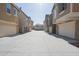 Street view showcasing the homes featuring attached garages and well-maintained driveways at 34979 N 30Th Ave, Phoenix, AZ 85086
