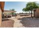 Expansive backyard featuring a covered patio, hot tub, mature trees, and ample space for outdoor activities and landscaping at 37334 N 17Th Ave, Phoenix, AZ 85086