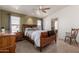Comfortable bedroom with natural light, ceiling fan, and en-suite bathroom entrance at 37334 N 17Th Ave, Phoenix, AZ 85086
