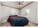 Bedroom with neutral carpet, decorative border and a window offering natural light and outdoor views at 37334 N 17Th Ave, Phoenix, AZ 85086