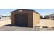 Exterior shot of detached one car garage with a roll up door and ample exterior room for parking and storage at 37334 N 17Th Ave, Phoenix, AZ 85086