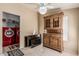 Laundry area with red washer and dryer units, and a wooden storage cabinet at 37334 N 17Th Ave, Phoenix, AZ 85086