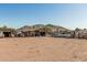 Extended view of the property with storage units, other structures, and distant mountain, useful space at 37334 N 17Th Ave, Phoenix, AZ 85086