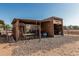 Exterior view of the on-site storage area with a metal enclosure and chain-link fencing, providing secure space at 37334 N 17Th Ave, Phoenix, AZ 85086