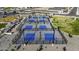 An aerial view of outdoor pickleball courts offering ample space and scenic landscaping at 37390 W Merced St, Maricopa, AZ 85138