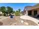 Well maintained desert landscaped backyard featuring a covered patio, mature trees, and serene surroundings at 4229 E Nightingale Ln, Gilbert, AZ 85298