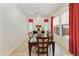 Elegant dining room with a large table, seating for six, and bright natural light at 4229 E Nightingale Ln, Gilbert, AZ 85298